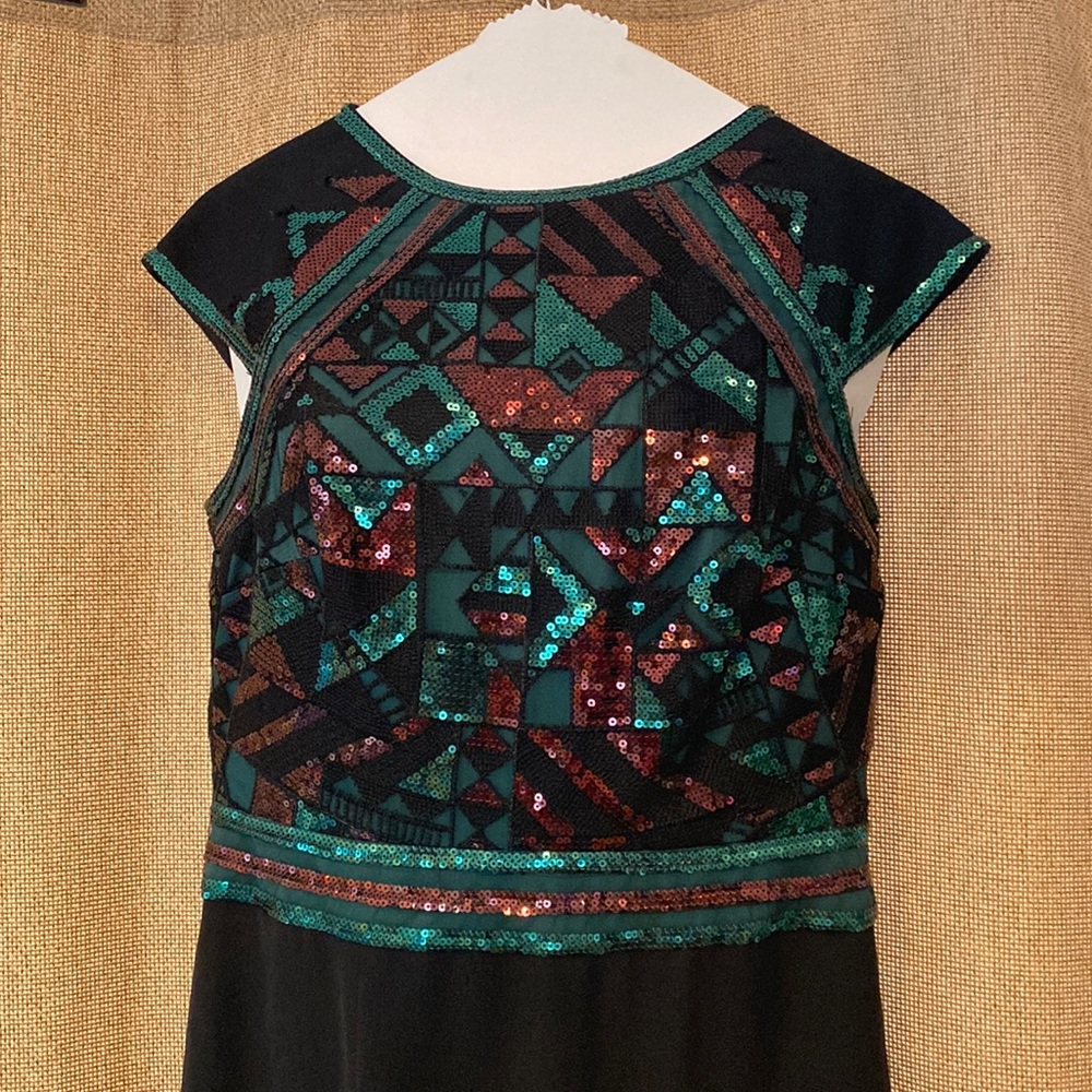 Sequined gown with slit and opened back